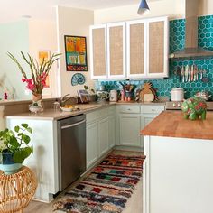 a kitchen with blue and white tiles on the walls