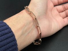 Rose Gold Bracelet With Solid Link As A Gift, Luxury Rose Gold Chain Bracelet For Everyday, Luxury Everyday Rose Gold Chain Bracelet, Everyday Luxury Rose Gold Chain Bracelet, Formal Rose Gold Oval Link Bracelets, Formal Rose Gold Oval Link Bracelet, Rose Gold Link Bracelet With Solid Construction, Classic Rose Gold Bracelet With Paperclip Chain, Rose Gold Paperclip Bracelet With Rectangular Links