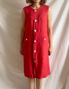 "Vintage red summer dress from Harrods London Composition: No composition label but feels 100% thick linen Condition: Quite good Size: This would fit from size S to L, depending on the desired fit (Garments are put flat while taking measurements.) Measurements: Total dress length: 103 cm (40.5\") Bust circumference: 106 cm (41.5\") Model's size : 38 EU, 173 cm  *Please concentrate on measurements, instead of size tags on the pieces. Vintage sizes don't always reflect modern sizing. *European Buy Vintage Knee-length Linen Summer Dress, Vintage Knee-length Linen Dress, Red Linen Short Sleeve Dress, Red Linen Dress With Short Sleeves, Casual Red Linen Dress, Vintage Linen Beach Dress, Sleeveless Red Linen Dress For Summer, Red Summer Dress, Red Linen Dress