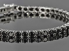 Black spinel 12.00ctw round, sterling silver tennis bracelet. Measures approximately 1/8"W. Black Spinel Jewelry, Black Spinel Bracelet, Custom Birthstone Ring, Black Diamond Bracelet, Diamond Party, Silver Tennis Bracelet, Man Made Diamonds, Wedding Jewelry Bracelets, Black Spinel