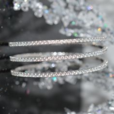 A Ladies Platinum Finish Sterling Silver Triple Wrap Flexible Bracelet With Simulated Diamonds. Flexible Bracelet, Coil Bracelet, The Sting, Mens Accessories Fashion, Silver Bracelets, Bangle Bracelets, Gold Bracelet, Platinum, Jewelry Accessories