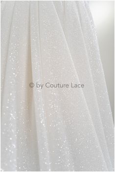 Introducing our exquisite double glued glitter tulle, specially designed to elevate the elegance and comfort of wedding dresses. This premium textile combines the timeless beauty of traditional bridal fabrics with the added benefit of stretch, ensuring a flawless fit and unrestricted movement on your special day. Choose our stretch fabric for your wedding dress and experience the perfect blend of elegance and flexibility. Let it embrace your every move, ensuring that you look and feel your best Fabric Glitter, Bridal Lace Fabric, Bridal Fabric, Loose Glitter, Glitter Print, Glitter Fabric, Tulle Fabric, White Glitter, Tulle Lace