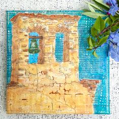 a painting of an old brick building with a bell on it and blue flowers in the background