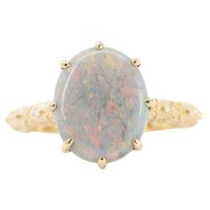 This bright and colorful Australian Opal gemstone is paired with a vintage-inspired lace band, creating a beautiful contrast and adding an elegant touch to the piece. ♥ The overall setting measures 13.6 mm in width, 11.5 mm in length, and sits 6.7 mm tall from the finger ♥ US size 7 (Free resizing up or down 1 size) ♥ Band width: 2 mm ♥ Material: 14k yellow gold ♥ Gemstone: Natural Australian opal 2.82ct, Diamonds 0.065ct ♥ All gemstones used are genuine, earth-mined, and guaranteed conflict-fre Opal Engagement Ring, Lace Bands, Opal Engagement, Right Hand Rings, Engagement Rings Opal, Gold Ring Sets, Bridal Bands, Bridal Ring Set, Bridal Ring