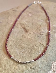 This pretty red seed bead necklace is made with Miyuki burgundy gold luster seed beads, a Hill Tribe silver tube beads with stamped flowers, Hill Tribe silver rondelle beads and flower stamped tube beads with a silver hook and eye clasp. There is a bracelet to match: https://www.etsy.com/listing/ The necklace is available 14-18 inches long. I am happy to provide complimentary gift wrap. If you'd like your item(s) wrapped, please leave a note at checkout. Please also let me know if you'd like me Chips Necklace, Mens Sterling Silver Jewelry, Small Bead Bracelet, Twisted Bangle, Small Necklace, Sterling Silver Bangle Bracelets, Elephant Necklace, Hill Tribe Silver, Beaded Jewelry Designs