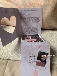 the inside of a card is open to show it's pages and heart cut out