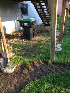 the back yard has been dug up and ready to be used as a storage area