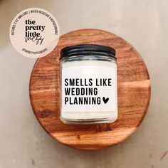 there is a small jar that says smells like wedding planning on it