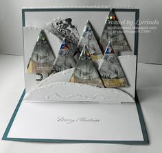 a christmas card with three trees made out of different types of paper and some words on it