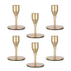 six gold candlesticks on metal bases