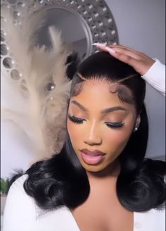 a woman is getting her hair done in front of a mirror