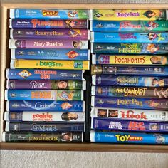 a wooden box filled with lots of disney movies