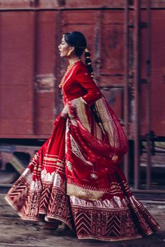 Royal Red Frock Pakistani Dress for Wedding has the perfect balance of tradition and elegance. This beautiful Pishwas Frock has premium cotton net fabric and is gracefully adorned with lavish details of Kundan, tilla, and Chatta Patti work, making this attire your foremost priority to have a classy look on the wedding. Frock: Pakistani Frock in the alluring red shade is a charismatic masterpiece to wear at the wedding. This beautiful frock is perfectly stitched and has a huge flare. This kalidaa Red Cutdana Chanderi Dress, Red Chanderi Dress With Cutdana Details, Red Dresses With Gota Work In Traditional Drape, Red Chanderi Dress With Sheer Dupatta, Red Dresses With Gota Work For Navratri, Red Festive Tilla Sharara, Red Dresses For Reception And Navratri, Red Gown For Navratri Reception, Red Gown For Reception And Navratri