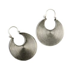 From our tribal silver collection hand made by the hill tribe in the golden triangle. These impressive tribal earrings are beautiful stylish addition to your everyday look and great accessory to an evening dress. Material: Silver Dimension: 55mm in total diameter Sold as a pair. These handcrafted pieces are 95% to 99% pure silver. The higher silver content (compared to sterling silver, which is 92.5%) makes the pieces softer and easier to shape. Oxidation, hammer marks, and slight design varianc