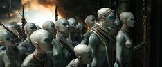 a group of alien men standing next to each other