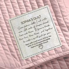 a pink quilt with a poem written on it