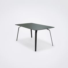 a black table sitting on top of a white floor