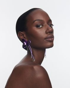 Crafted with meticulous attention to detail, The Ophelia Flower Earrings feature an abstract floral design and silk cord detail with delicate dangling crystal drops. The vibrant purple hue adds a pop of color to your ensemble, instantly elevating your style. Why You'll Love It These earrings are a true blend of elegance and playfulness, designed to make a statement wherever you go. Details Ceramic coated Silk cord Crystal Sterling silver posts Butterfly fastening and post back for pierced ears I Suede Jewelry, Abstract Floral Design, Gold Vermeil Jewelry, Vibrant Purple, Silk Cord, Abstract Flower, Vermeil Jewelry, Solid Gold Jewelry, Purple Hues