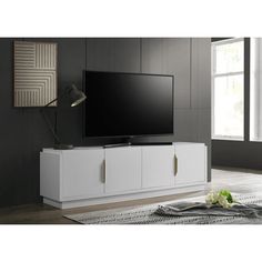 an entertainment center with a large flat screen tv