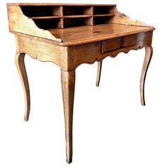 an old wooden desk with drawers on the top and bottom shelf, sitting against a white background