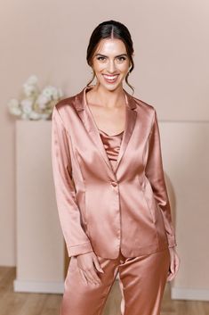 For the bridesmaid that doesn't want a dress, we have you covered! The new Ruby Satin Jacket & Pants set provides a glamorous alternative to a dress and will still have you feeling chic, confident, and comfortable all night long! The Ruby Jacket and Ruby Pants are sold separately. Lindsey size 4, pictured with the Flynn Satin Top in Desert Rose, sold separately. Laken size 24, pictured with the Heidi Chiffon Top in White Pearl, sold separately. FEATURES: Fitted Jacket silhouette Long sleeves Thr