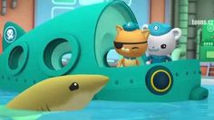 two cartoon characters are in a boat with a shark and a cat on the front