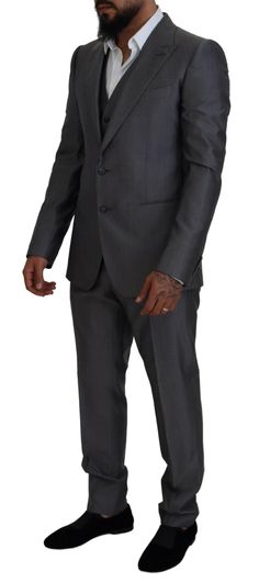 Dolce & Gabbana Sicilia Suit in Dark Gray: Single breasted, slim fit 3-piece suit with blazer, pants, and vest in luxurious Italian wool and silk blend. Features two button closure, two inside pockets, one open vent in the back, and 3-way pants zipper closure. Lined with high-quality materials for an exclusive and expertly crafted look. Color: Gray silver solid Model: Sicilia Style: Single breasted 3 piece suit; includes blazer and pants and vest Closure: Two button closure Fitting: Slim Fit Two Dolce And Gabbana Suits, Formal Loafers, Slim Fit Suit, Dolce E Gabbana, 3 Piece Suits, Boot Pumps, Armani Exchange, Dolce & Gabbana, Modern Man