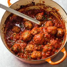 a pot filled with meatballs and tomato sauce