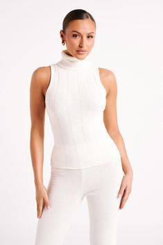 Your other half. ANGELINA is a sleeveless top with a high turtleneck collar and ribbed detail. The knit nylon and elastane fabrication gives it a bodycon fit that’s comfortable and flattering. The neckline is a long, rollover turtleneck that adds visual texture to the otherwise simple, minimalist design. This is a fresh take on a timeless piece and matches perfectly with the Angelina Knit Pants. High Turtleneck, Dresses Date Night, Turtleneck Sleeveless, Black Dress Prom, Wardrobe Update, Visual Texture, Ribbed Turtleneck, Other Half, Black Wedding Dresses