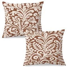 two brown and white pillows on a white background