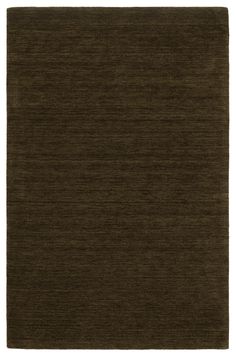 a dark brown rug on a white background