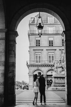 A black and white photo of a couple kissing during their photoshoot in Paris. A Couple Kissing, Paris Black And White