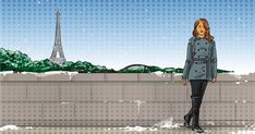 a woman standing in front of the eiffel tower