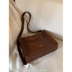 A crossbody bag with a retro design that has a moderately sized rectangular body that is easy to use on a daily basis. It has a distinctive shiny leather feel and has a pocket inside. The length of the shoulder strap can be adjusted. 
 
 
 Color 
 
 Dark brown 
 Black 
 
 
 Size 
 
 
 FREE size 
 
 Height: 22cm 
 Width: 31cm 
 Depth: 11.5cm 
 
 
 
 
 
 Material 
 
 Leather Black Cross Body Bag, Retro Design, Easy To Use, Inside Pocket, Free Size, Dark Brown, Crossbody Bag, Shoulder Strap, Leather