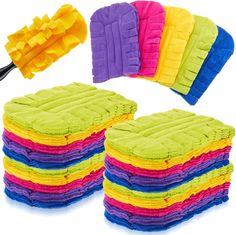 multicolored microfit cleaning cloths and dust mitts on white background