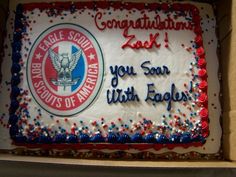 a cake in a box that says congratulations dad you scan with eagles