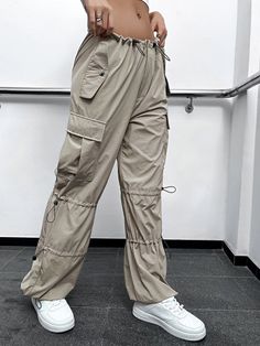 Step into fashion-forward territory with our Drawstring Detail Flap Pocket Parachute Cargo Pants. Designed as parachute pants with a drawstring waist, they offer a stylish twist to your everyday look. The non-stretch fabric composition of Polyamide and Spandex ensures durability. Details: Type: Parachute Pants Closure Type: Drawstring Waist Details: Drawstring, Button, Pocket, Zipper Waist Line: Drop Waist Length: Long Fit Type: Regular Fit Fabric: Non-Stretch Material: Fabric Composition: 95% P Parachute Cargo Pants, Parachute Cargo, Drawstring Detail, Waist Length, Drop Waist, Flap Pocket, Everyday Look, Drawstring Waist, Cargo Pants