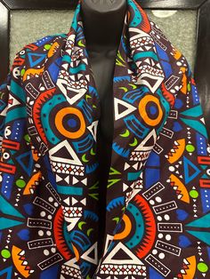 This is a nice light weight African  shawl or scarf  that is 100 % cotton. It is 72 inches long and 25 inches wide. It can be worn by male or female . The scarf can be worn over the shoulder , around the neck across the shoulder or around the waist. This a great authentic gift. Do t delay order yours today. Bohemian Multicolor Scarves For Festival, Bohemian Multicolor Scarf For Festivals, Multicolor Bohemian Scarves For Festivals, Multicolor Silk Shawl For Festival, Bohemian Multicolor Silk Scarf For Festivals, Multicolor Bohemian Silk Shawl, Bohemian Multicolor Shawl Scarves, Bohemian Multicolor Shawl Scarf, Traditional Multicolor One-size Scarves