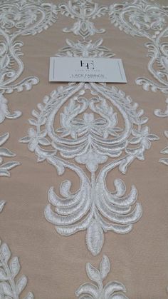 an image of a table cloth with white lace on it