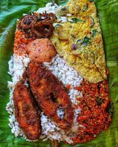 an assortment of food is on a green plate with rice and meats in it