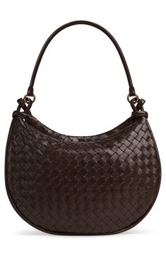 With this soft leather shoulder bag, crafted in the house's iconic intrecciato weave, a removable exterior pouch captures all the things you want close at hand. Top zip closure Shoulder strap Removable exterior zip pouch; interior zip pocket Lined Leather Made in Italy Designer Handbags Elegant Brown Hobo Bag With Woven Leather, Luxury Shoulder Bag With Intrecciato Weave For Shopping, Brown Intrecciato Weave Evening Shoulder Bag, Luxury Intrecciato Weave Shoulder Bag For Shopping, Intrecciato Weave Crossbody Shoulder Bag For Office, Formal Intrecciato Weave Shoulder Tote Bag, Formal Intrecciato Weave Tote Shoulder Bag, Formal Satchel Bag With Intrecciato Weave, Luxury Intrecciato Weave Satchel Shoulder Bag