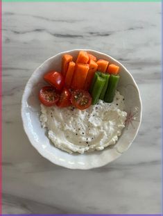 a white bowl filled with mashed potatoes, carrots and celery