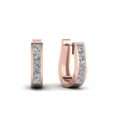 The Huggie Diamond Earrings add elegance to your style exhibiting a series of gorgeous princess cut stones arranged excellently in a classic channel setting. The diamond earring displays a magnificent hoop pattern for an added charm and flair.  Princess cut stones of 0.60 Total Carat Weight with Clarity SI2 and Color G in a channel setting.  Total Number of Stones:- 10 The huggie diamond hoop earring can also be obtained in various other preciosu metals and gemstones of your preference. Free shipping within USA. One Year Manufacturing Warranty.  Easy Returns With Lifetime Upgrade.  Have a glimpse of the genuine customer reviews provided by our satisfied customers. Professionals of the medical field, lawyers, government employees, military officers and university staff c Rose Gold Brilliant Cut Diamond Earrings For Gift, Luxury Rose Gold Huggie Earrings With Diamond Cut, Luxury 14k Gold Earrings With Rose Cut Diamonds, Luxury Rose Gold Single Diamond Earring, Rose Gold Diamond-cut Hoop Earrings, Diamond-cut Diamond Hoop Earrings In Rose Gold, Earring Displays, Diamond Gift, Rose Gold Metal