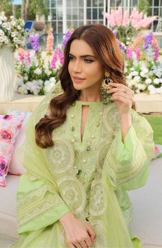 Elegant Light Green Salwar Kameez Pakistani Eid Dress is a premium Lawn masterpiece to have a stunning look on the festive occasion. This beautiful Kameez Trouser is adorned with lavish designs and embroidery, making it a perfect choice to have your desired appearance. Kameez: Beautiful kameez in the green shade has premium Lawn fabric. The borders of this kameez are adorned with an organza patch. The front and back of this Lawn Kameez are fully emblazoned with graceful work of embroidery, maki Green Salwar Kameez, Salwar Kameez Pakistani, Eid Dress, Eid Dresses, Lawn Fabric, Engagement Dresses, Organza Dupatta, Printed Trousers, Pakistani Designers