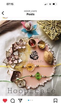 a close up of a plate on a bed with beads and other items around it