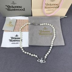 Brand New Vivienne Westwood Silver Orb Pearl Choker Necklace Button Necklace (Brand New) Brand New, Never Worn, Nwot 100% Authentic Comes With Gift Box, Gift Bag, And Dust Bag,Brand Cards,Instruction Manual,Jewelt Cloth. Full Packing As Inculded. Necklace Packed In Secure Packaging For Transit The Length Was : 16.5'' Welcome To Button Necklace, Pearl Choker Necklace, Necklace Brands, Instruction Manual, Pearl Choker, Box Gift, Bag Brand, Vivienne Westwood, White Silver