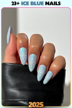 Ice blue nails with winter-inspired snowflake art. A subtle yet festive design perfect for celebrating the season while keeping a refined look.