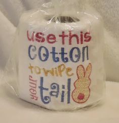 a toilet paper roll wrapped in plastic with the words use this cotton to wipe it