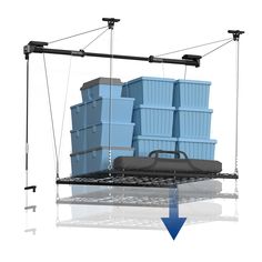 a bunch of blue containers on a metal rack with an arrow pointing to the bottom