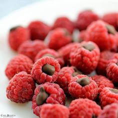 raspberries and chocolate chips on a white plate